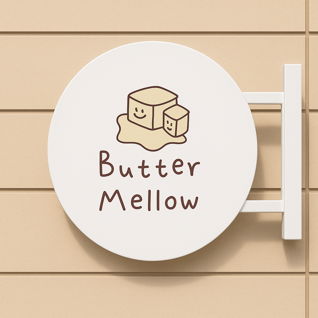 Round sign with 'Butter Mellow' text and cartoon butter design on a wooden background